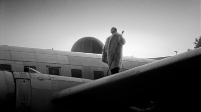 a man standing on the nose of an airplane