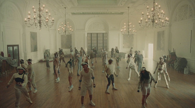 a group of people dancing in a large room