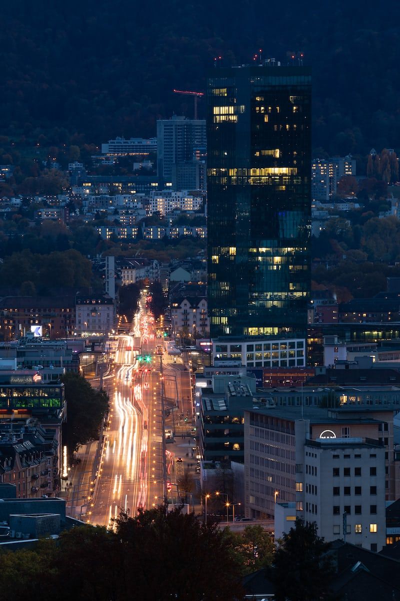 a view of a city at night from a hill