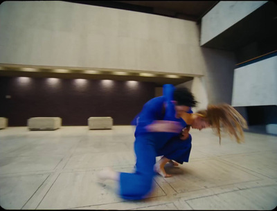 a man and a woman dancing in a building