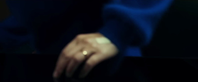 a blurry photo of a person's hand holding a cell phone