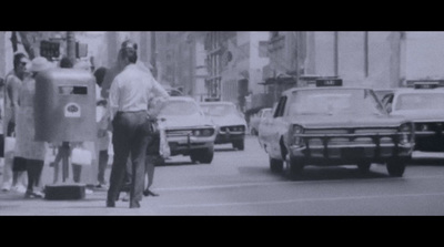 a black and white photo of a city street