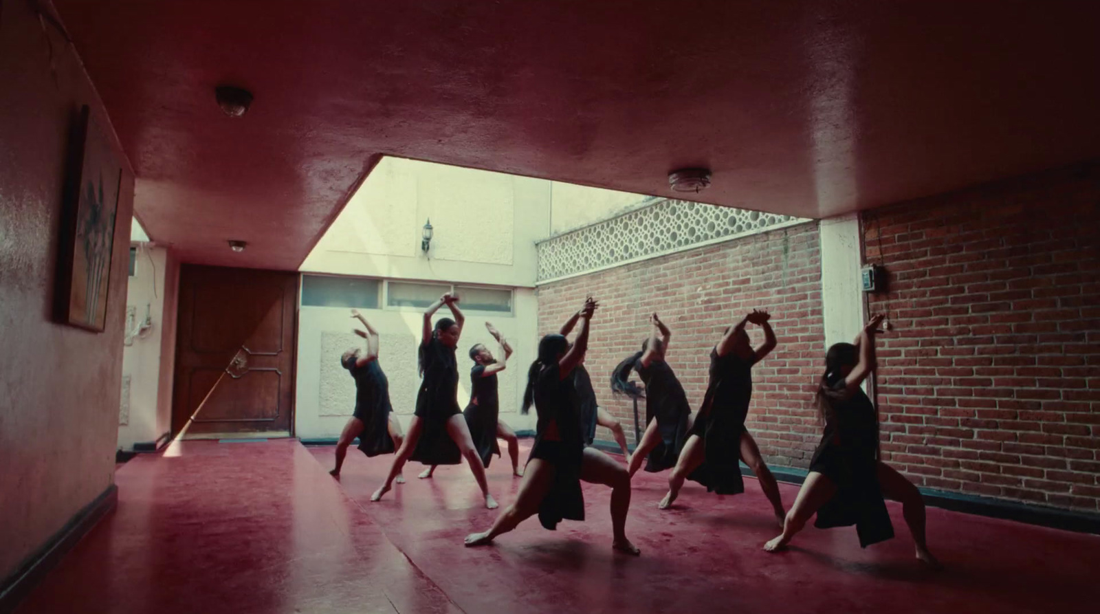 a group of women dancing in a room