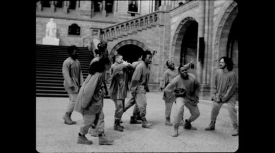 a group of people standing in front of a building