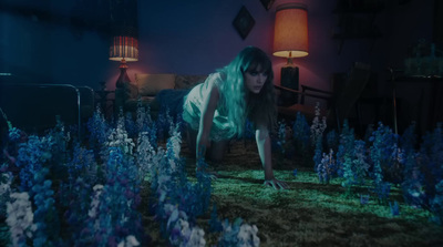 a woman with green hair is in a field of flowers