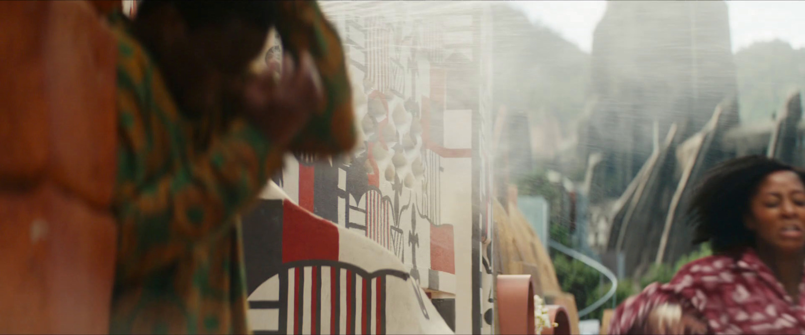 a woman sitting at a table in front of a window