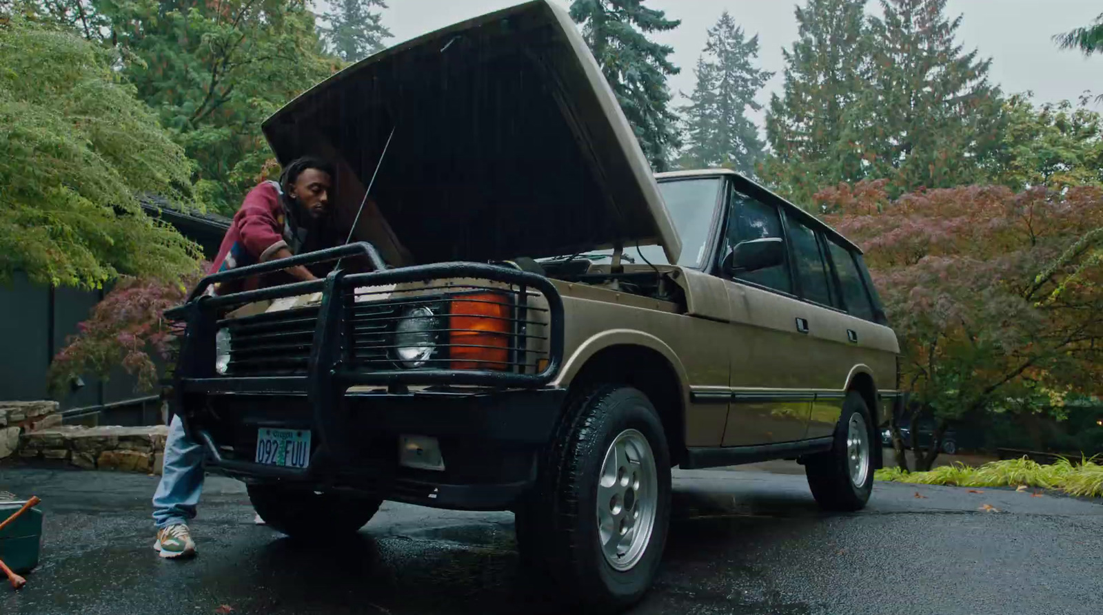 a man standing in the back of a truck