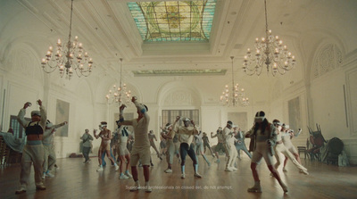 a group of people dancing in a large room