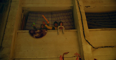 a group of people hanging out of a window