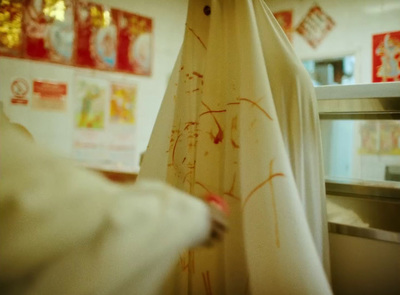 a white curtain with red writing on it