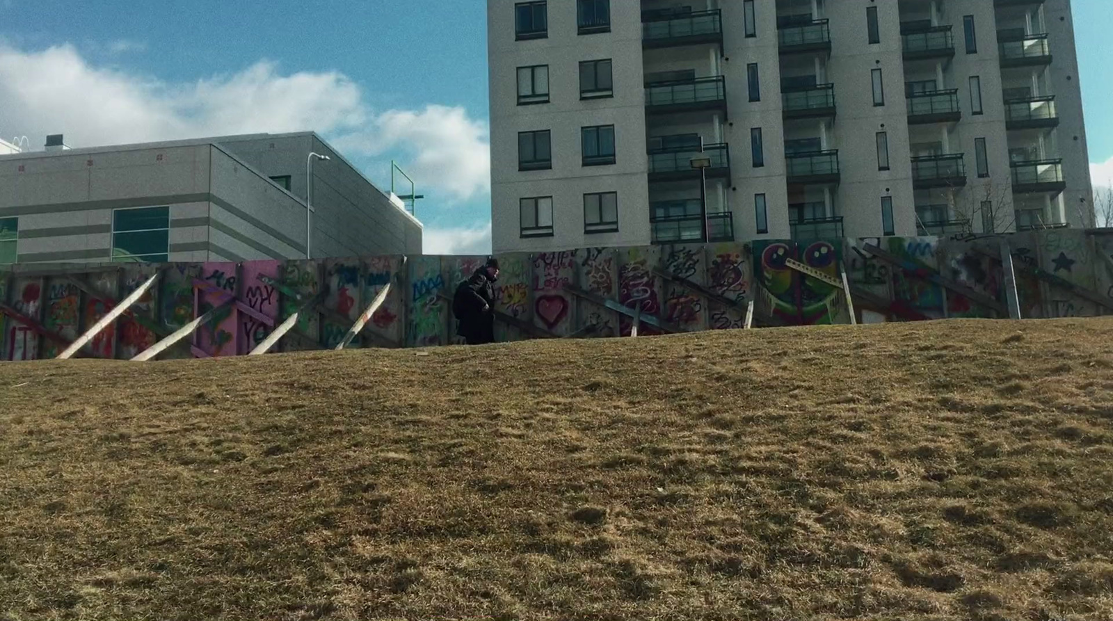 a large building with graffiti on the side of it