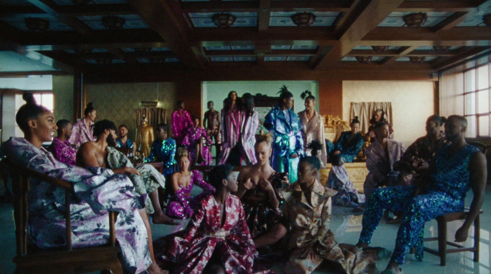 a group of people sitting in chairs in a room