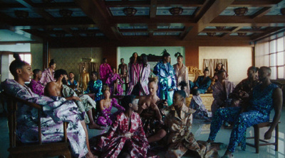 a group of people sitting in chairs in a room