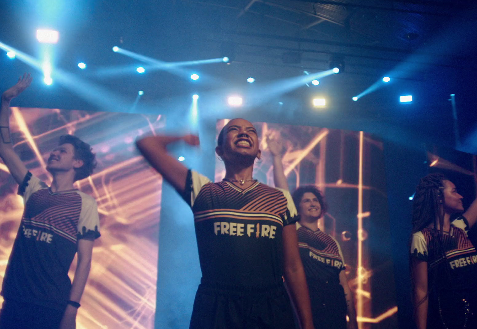 a group of people standing on top of a stage