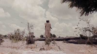 a man standing on top of a sandy beach