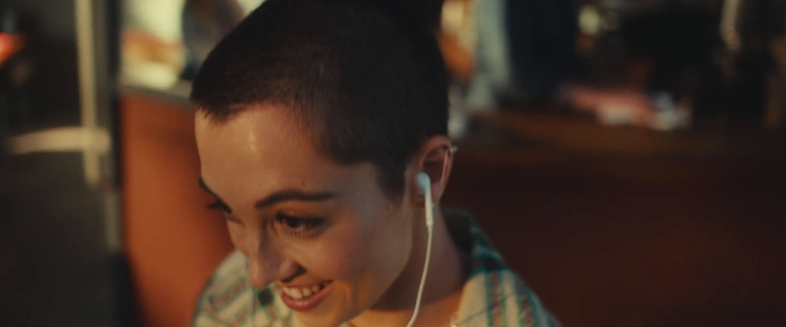 a young man with ear buds on his ears