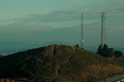 a hill with a cell tower on top of it