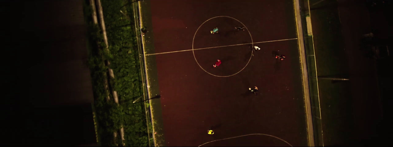 an overhead view of a basketball court at night