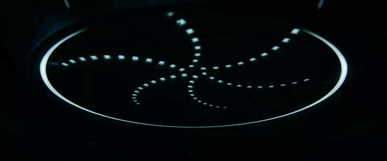 a close up of a circular object in the dark