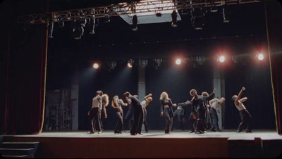 a group of people standing on top of a stage