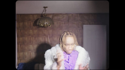 a woman with dreadlocks standing in a room