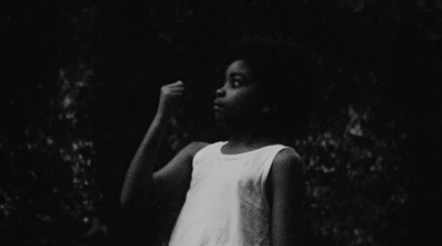 a black and white photo of a young girl