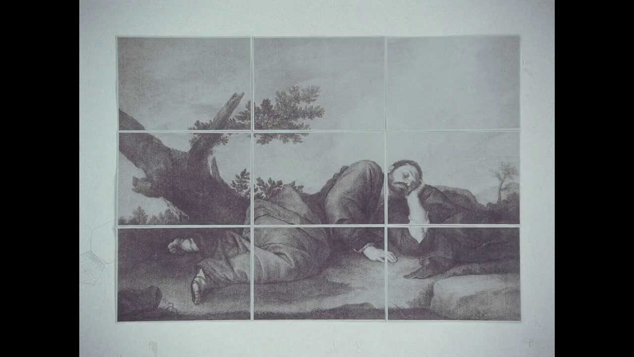 a black and white photo of a painting on a wall