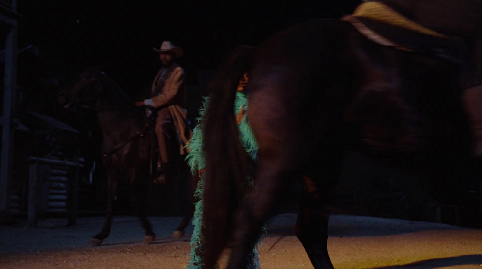 a man riding on the back of a brown horse