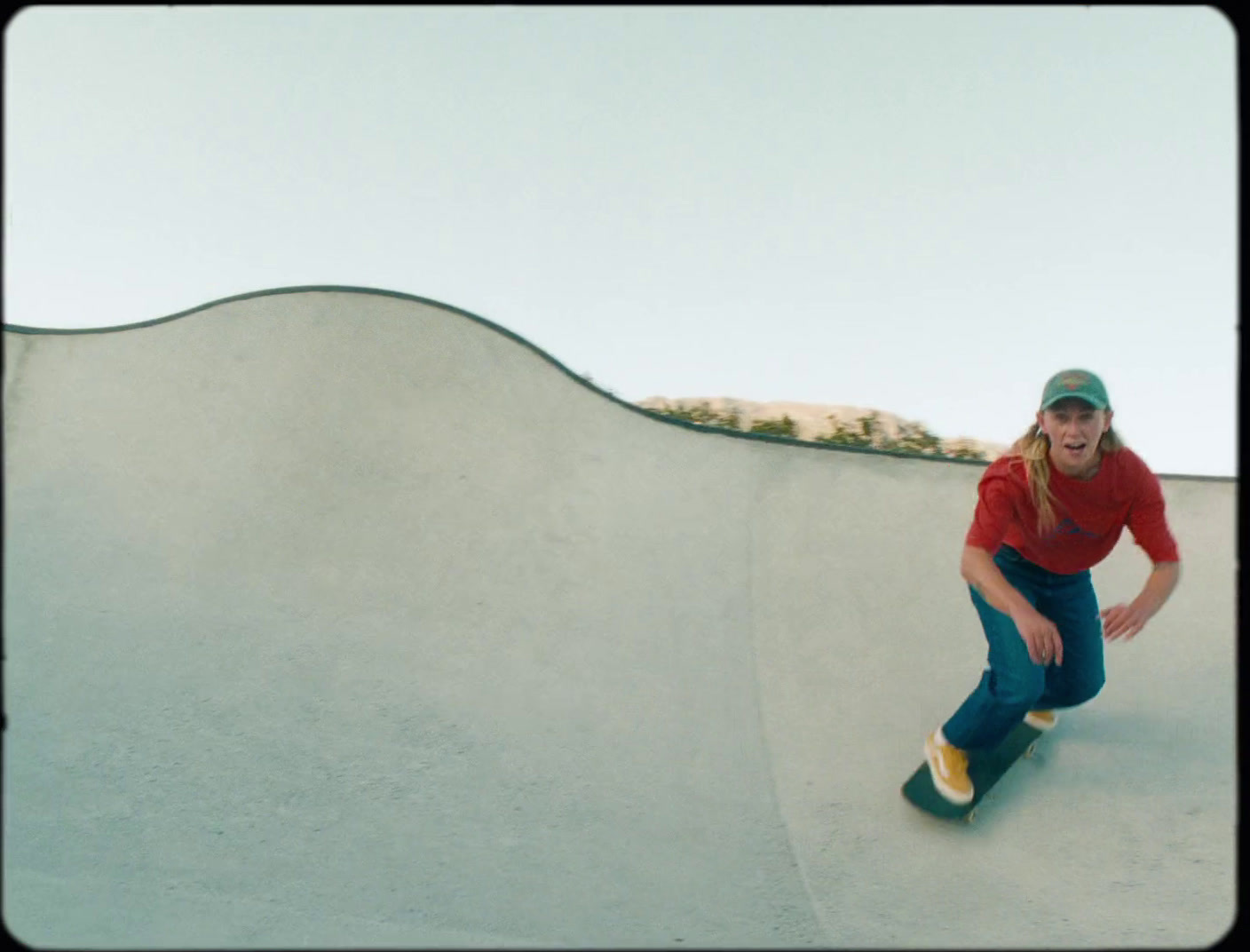 a man riding a skateboard up the side of a ramp