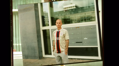 a man standing in front of a building