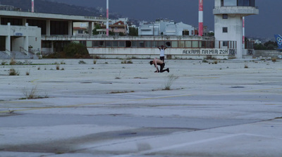 a person is running in an empty parking lot