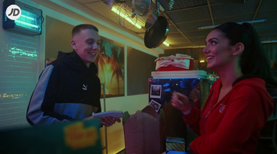 a man standing next to a woman in a room