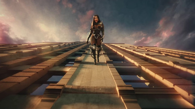 a woman walking across a bridge in a futuristic world