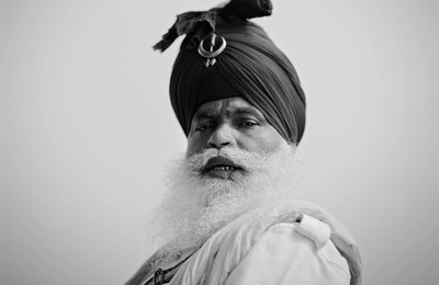 a black and white photo of a man with a turban