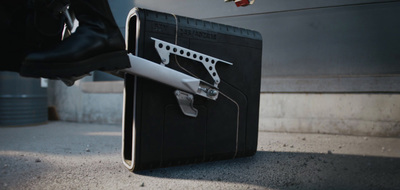 a piece of luggage with a gun attached to it