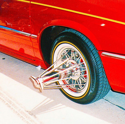 a red car parked on the side of the road