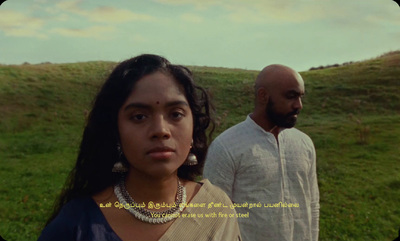 a woman standing next to a man in a field