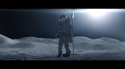 a man in a space suit standing on the moon