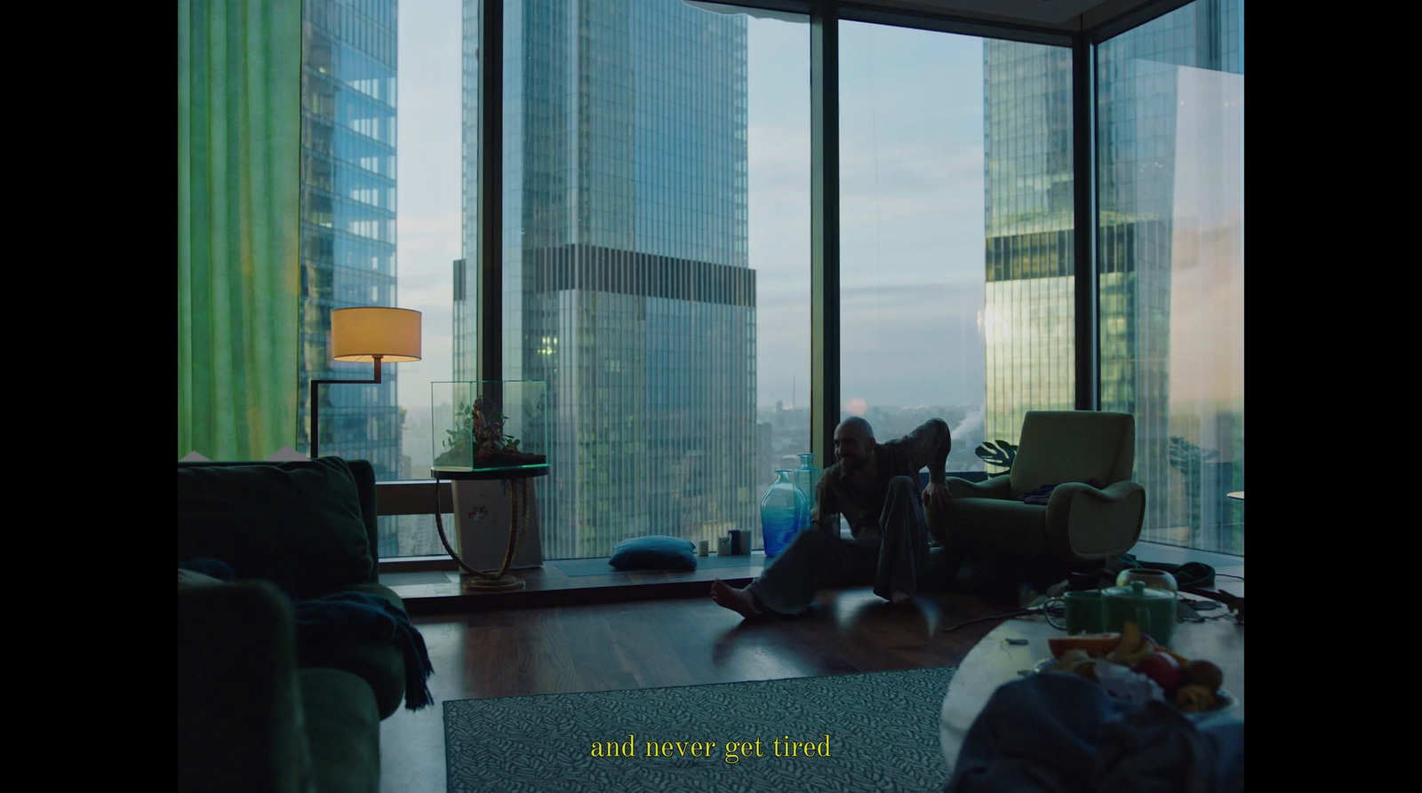 a woman sitting on a couch in a living room