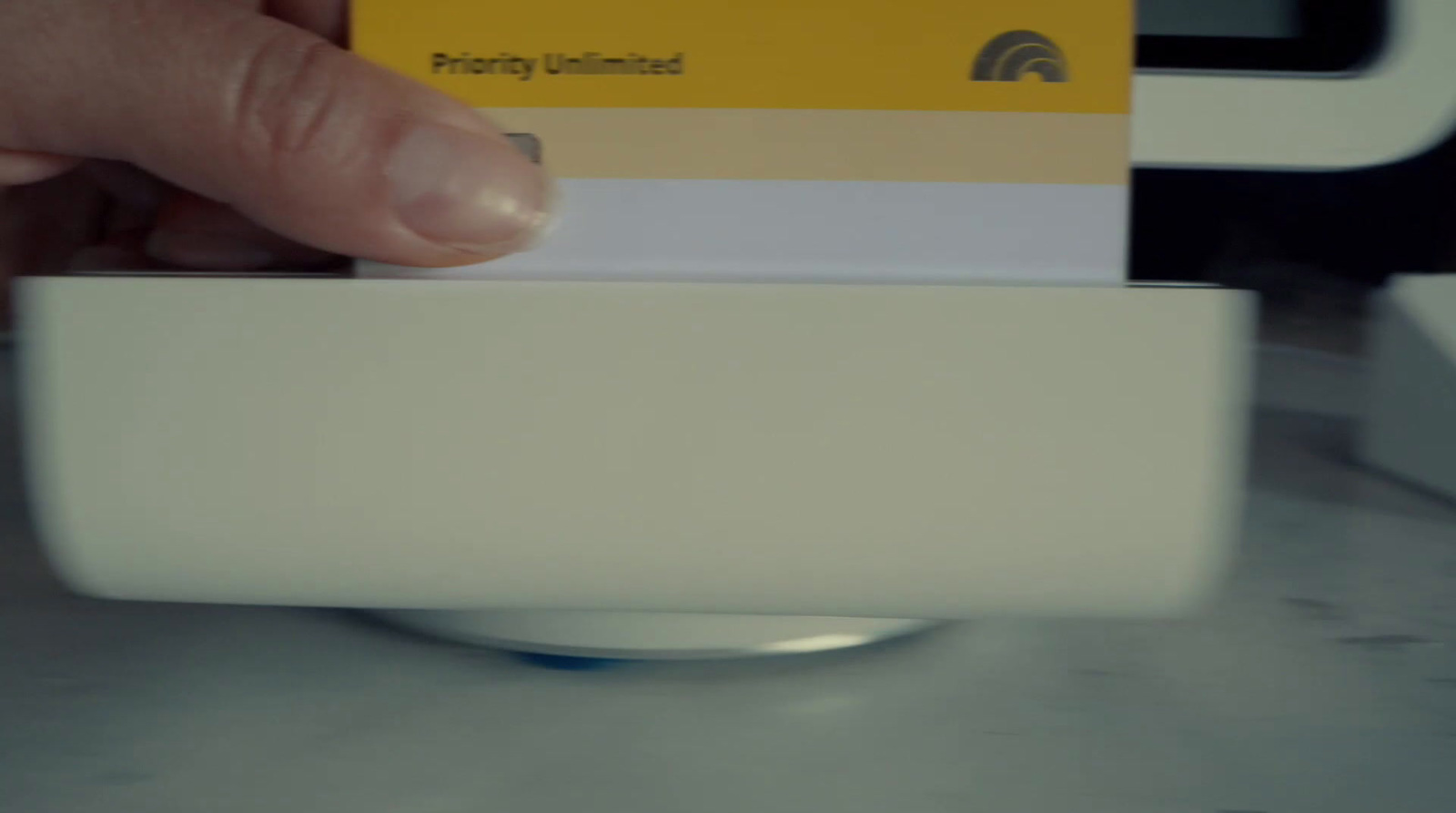 a person holding a yellow and white business card