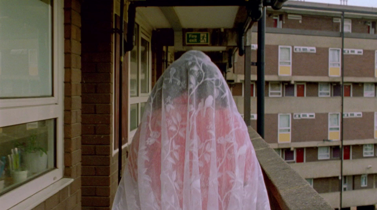 a person in a veil on a balcony