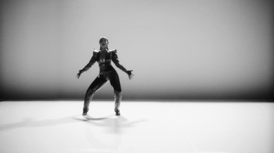 a black and white photo of a woman dancing