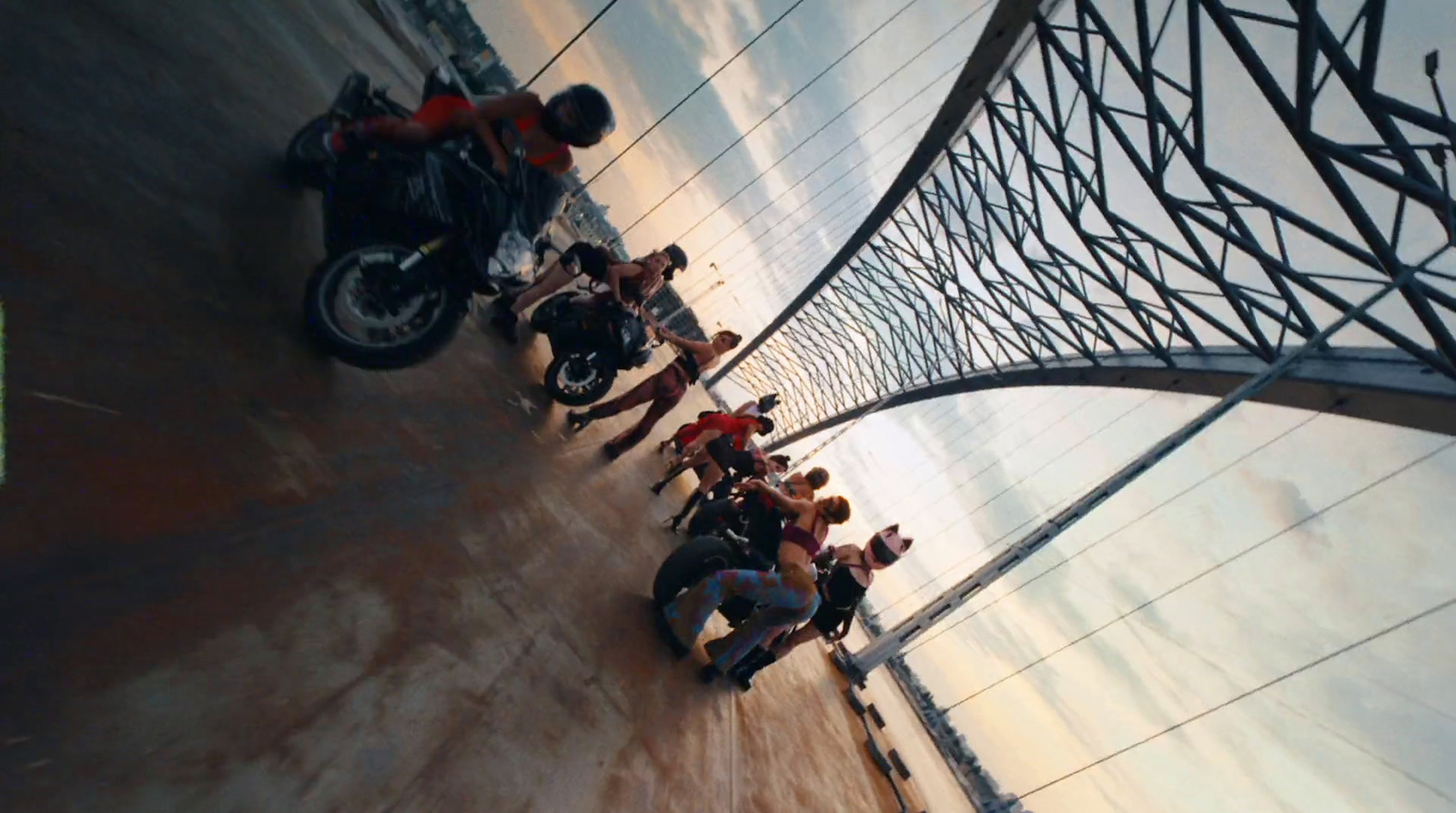 a group of people standing next to a motorcycle