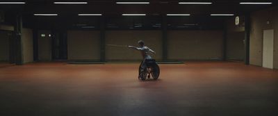 a person on a wheel chair in a room