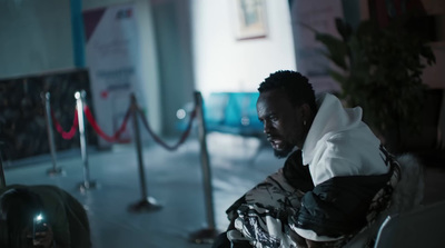 a man sitting in a chair in a room