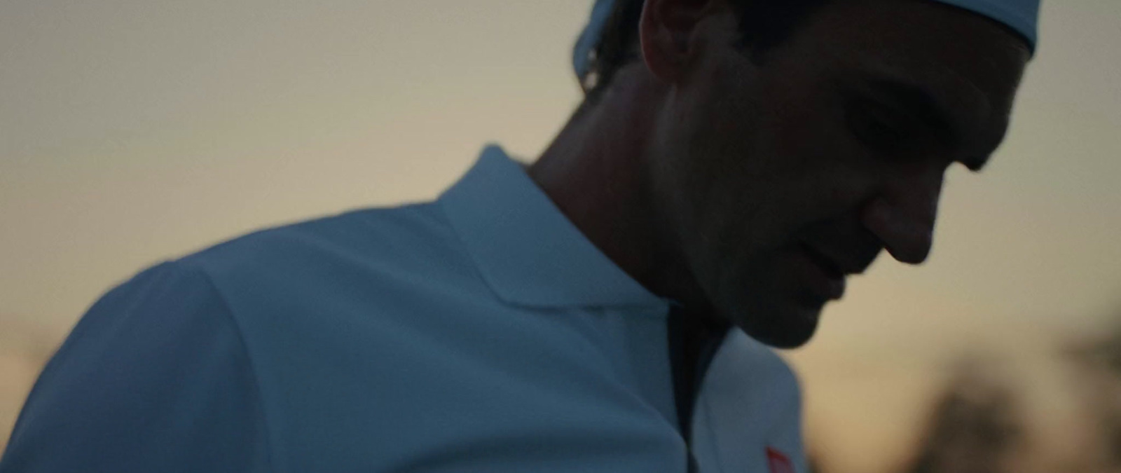 a close up of a man wearing a white shirt