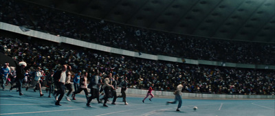 a group of people playing a game of soccer