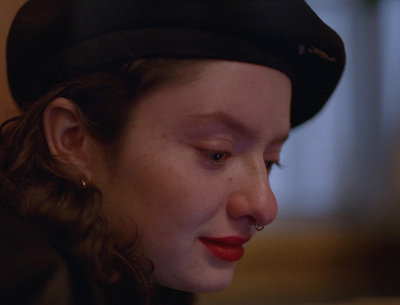 a close up of a person wearing a hat