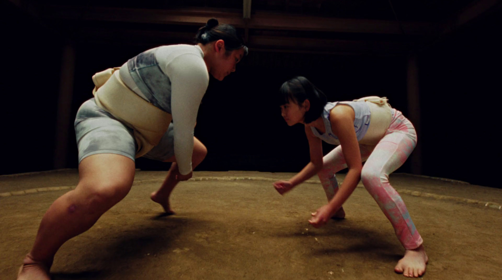 a couple of people that are standing in the dirt