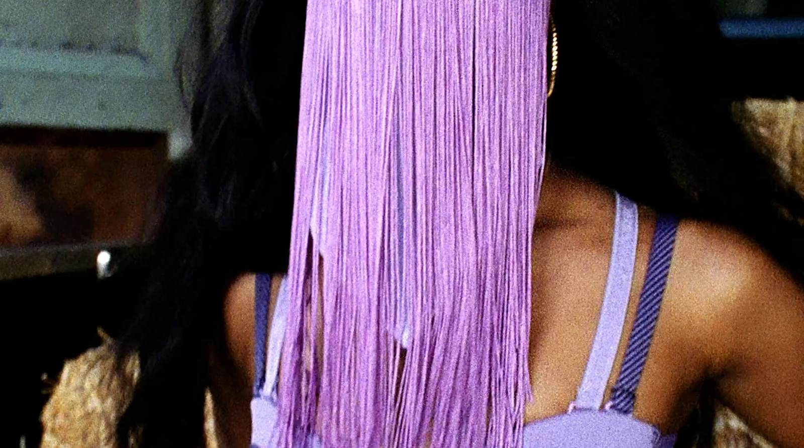 a close up of a woman with long purple hair